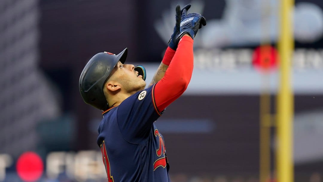 Minnesota Twins shortstop Carlos Correa celebrates while crossing home plate after hitting a solo home run during the first inning of a baseball game against the Kansas City Royals, Thursday, Sept. 15, 2022, in Minneapolis.