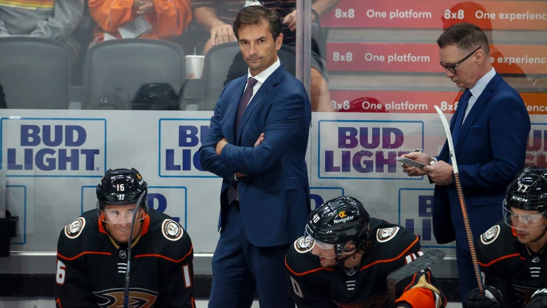 Anaheim Ducks head coach Dallas Eakins watches from behind the bench during the third period of an NHL preseason hockey game against the Arizona Coyotes Wednesday, Sept. 28, 2022, in Anaheim, Calif.