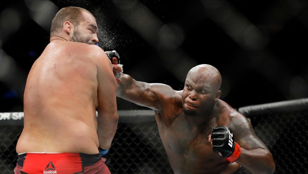 FILE - In this Nov. 2, 2019, file photo, Derrick Lewis, right, punches Bulgaria's Blagoy Ivanov during the second round.