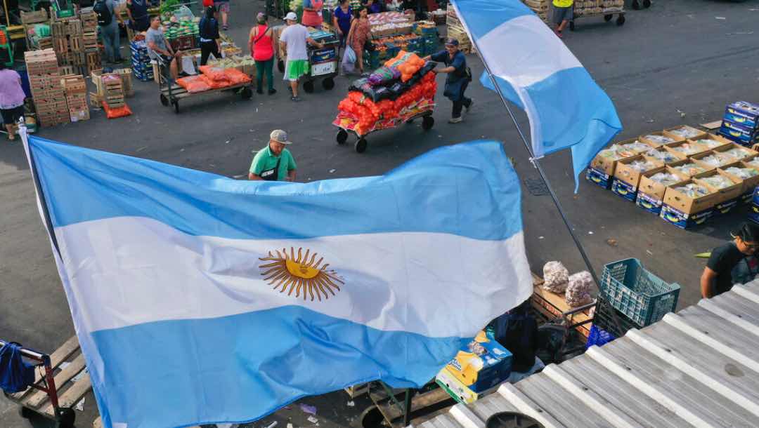 Argentine flags fly at the Central Market on the day Argentina's soccer team will play Poland at the World Cup, hosted by Qatar, in Buenos Aires, Argentina, Wednesday, Nov. 30, 2022.