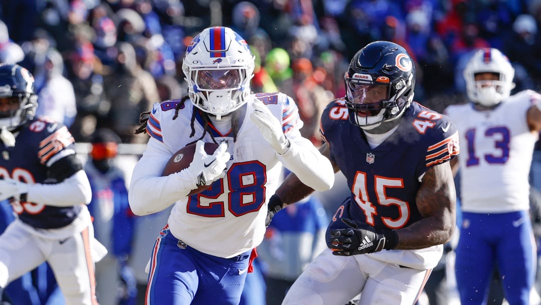 Buffalo Bills running back James Cook (28) runs in for a touchdown during the second half of an NFL football game against the Chicago Bears, Saturday, Dec. 24, 2022, in Chicago.