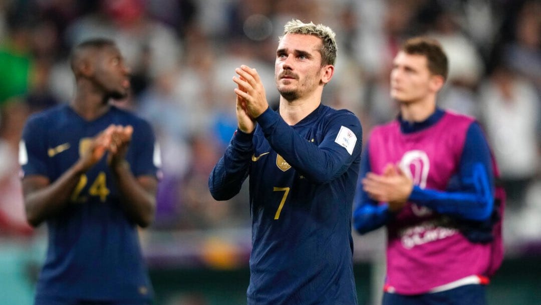 France's Antoine Griezmann applauds after the World Cup group D soccer match between Tunisia and France at the Education City Stadium in Al Rayyan , Qatar, Wednesday, Nov. 30, 2022. Defending champion France won its World Cup group despite losing to Tunisia 1-0.