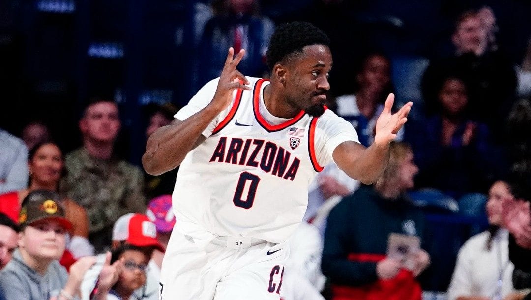 Arizona's Courtney Ramey celebrates a three pointer during the first half of an NCAA college basketball game against California, Sunday, Dec. 4, 2022, in Tucson, Ariz.