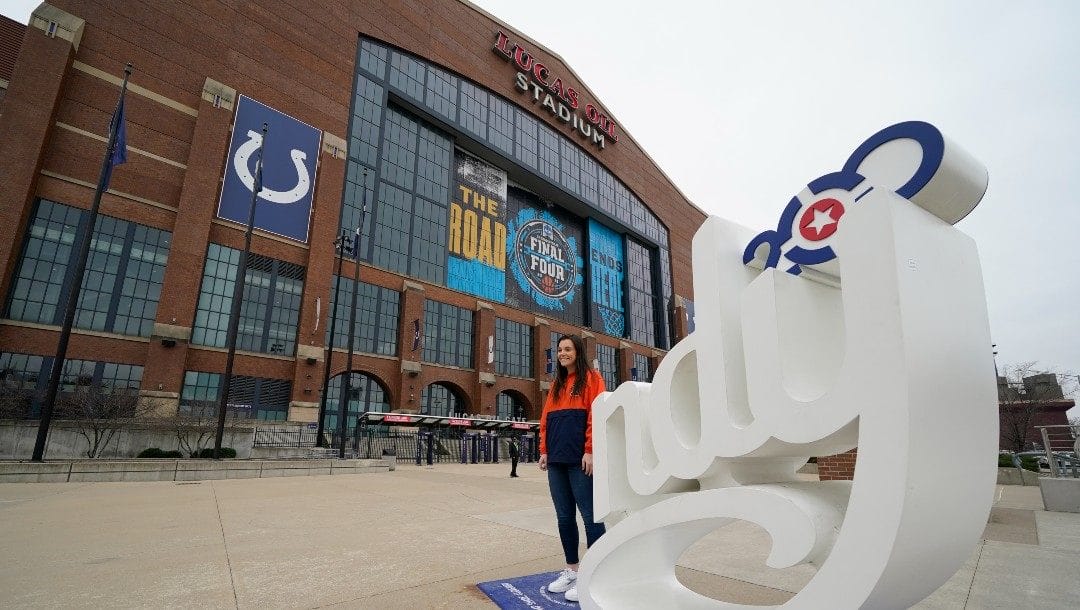 Regan O'Brien poses for a photo outside of Lucas Oil Stadium before an NCAA college basketball championship game between Illinois and Ohio State at the Big Ten Conference tournament, Sunday, March 14, 2021, in Indianapolis.