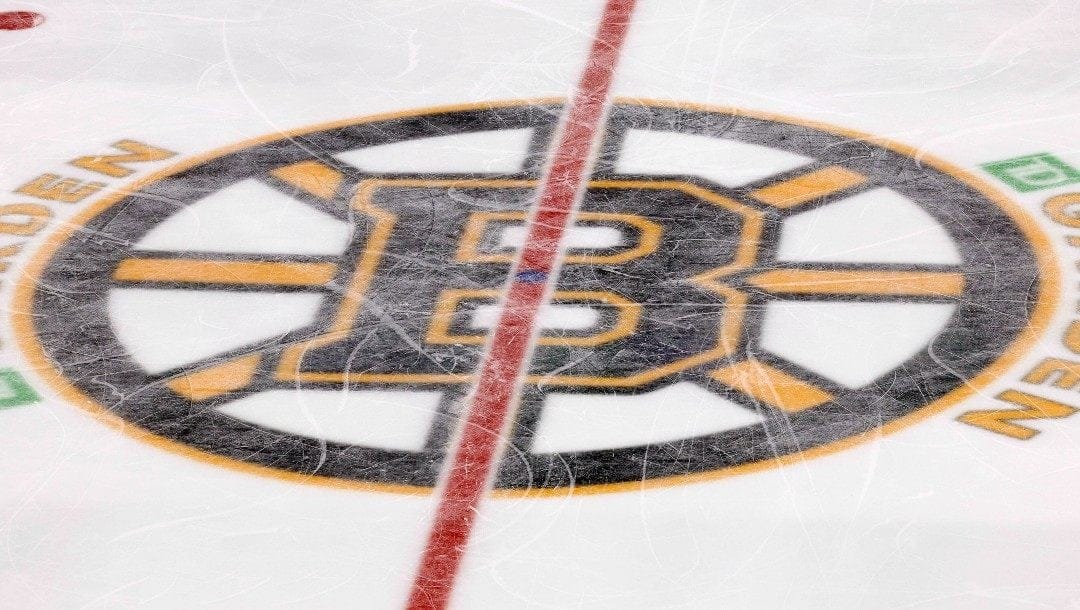 The Boston Bruins logo is seen at center ice at TD Garden during the third period of an NHL hockey game between the Boston Bruins and the Colorado Avalanche Monday, Feb. 21, 2022, in Boston.