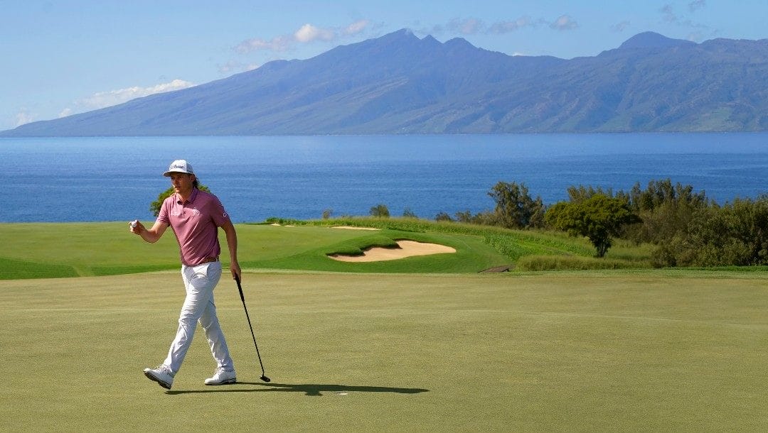 Cameron Smith waves after making birdie on the 13th green during the final round of the Tournament of Champions golf event, Sunday, Jan. 9, 2022, at Kapalua Plantation Course in Kapalua, Hawaii.