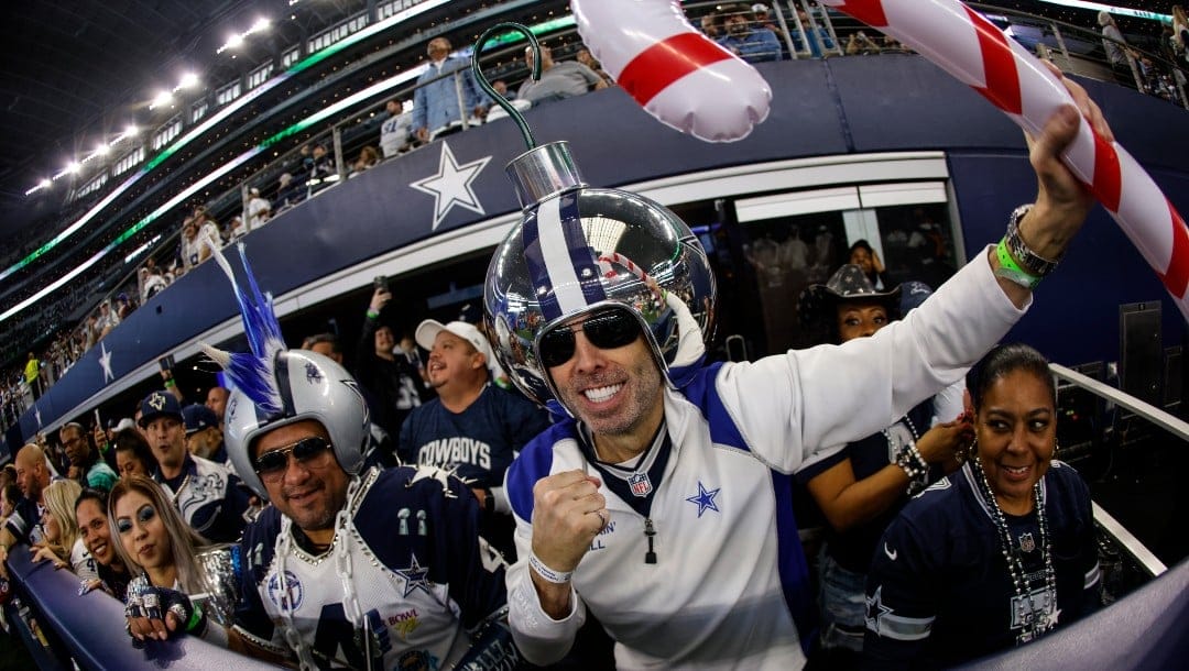 Dallas Cowboys fans wait for the start of an NFL football game against the Houston Texans, Sunday, Dec. 11, 2022, in Arlington, Texas. (AP Photo/Ron Jenkins)