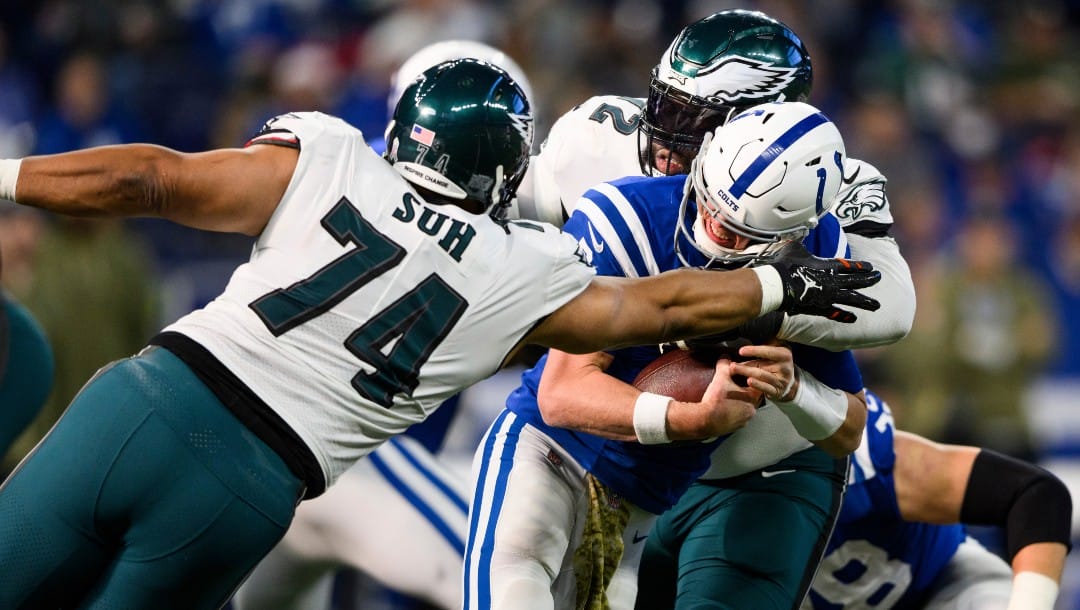Philadelphia Eagles defensive tackle Linval Joseph (72) and Philadelphia Eagles defensive tackle Ndamukong Suh (74) sack Indianapolis Colts quarterback Matt Ryan (2) during an NFL football game, Sunday, Nov. 20, 2022, in Indianapolis. (AP Photo/Zach Bolinger)