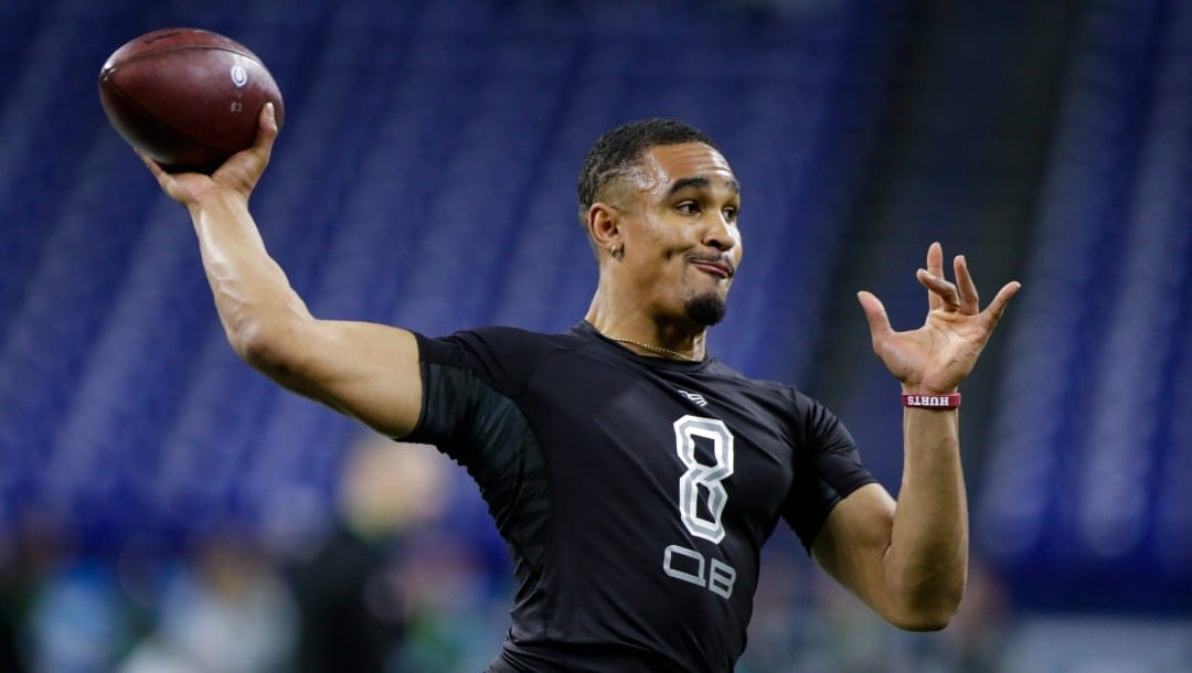FILE - In this Feb. 27, 2020, file photo, Oklahoma quarterback Jalen Hurts runs a drill at the NFL football scouting combine in Indianapolis. Hurts was selected by the Philadelphia Eagles in the second round of the NFL football draft Friday, April 24, 2020. (AP Photo/Michael Conroy, File)
