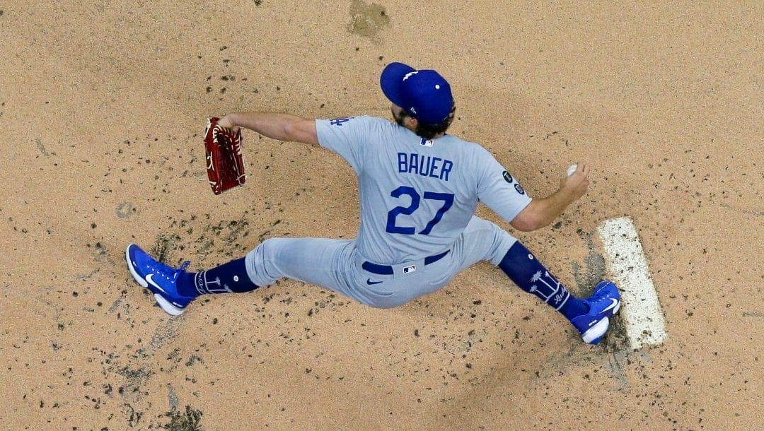 Los Angeles Dodgers starting pitcher Trevor Bauer throws during the first inning of a baseball game against the Milwaukee Brewers Thursday, April 29, 2021, in Milwaukee.