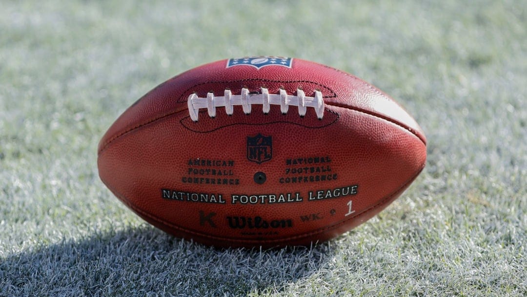 Wilson football sits on the field during the second half of an NFL football game between the Chicago Bears and Miami Dolphins, Sunday, Nov. 6, 2022, in Chicago. (AP Photo/Kamil Krzaczynski)