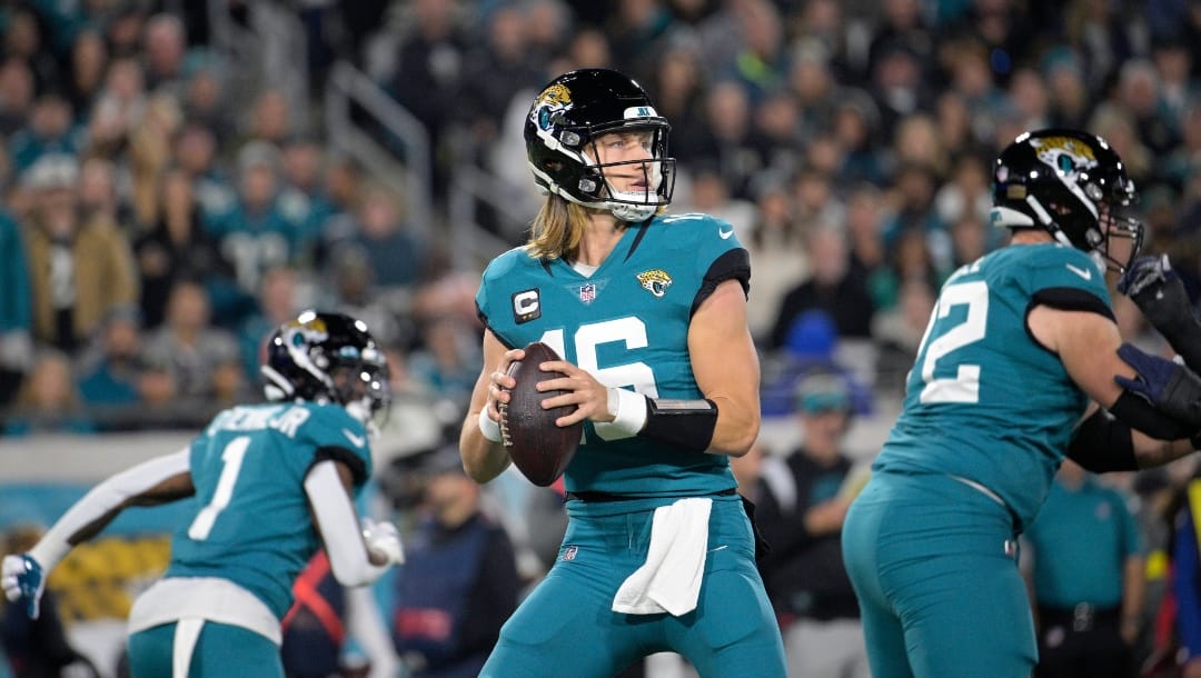 Jacksonville Jaguars quarterback Trevor Lawrence (16) looks for a receiver during the first half of an NFL football game against the Tennessee Titans, Saturday, Jan. 7, 2023, in Jacksonville, Fla. (AP Photo/Phelan M. Ebenhack)