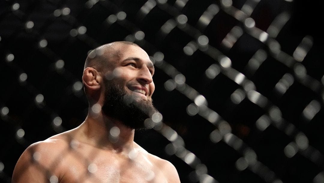 Khamzat Chimaev smiles after defeating Kevin Holland in a 180-pound catchweight bout during the UFC 279 mixed martial arts event.