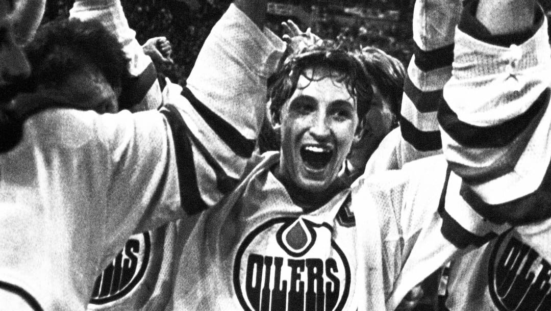 FILE - In this May 19, 1984, file photo, Wayne Gretzky and the Edmonton Oilers carry off the Stanley Cup after defeating the New York Islanders in Edmonton. Gretzky was "The Great One" and Mario Lemieux was "The Magnificent One."The hockey world is always looking for a new superstar to transcend the sport. (AP Photo/Larry MacDougall, File)