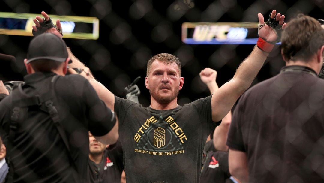 FILE - In this Jan. 21, 2018, file photo, Stipe Miocic gestures after a win over Francis Ngannou during a heavyweight championship.