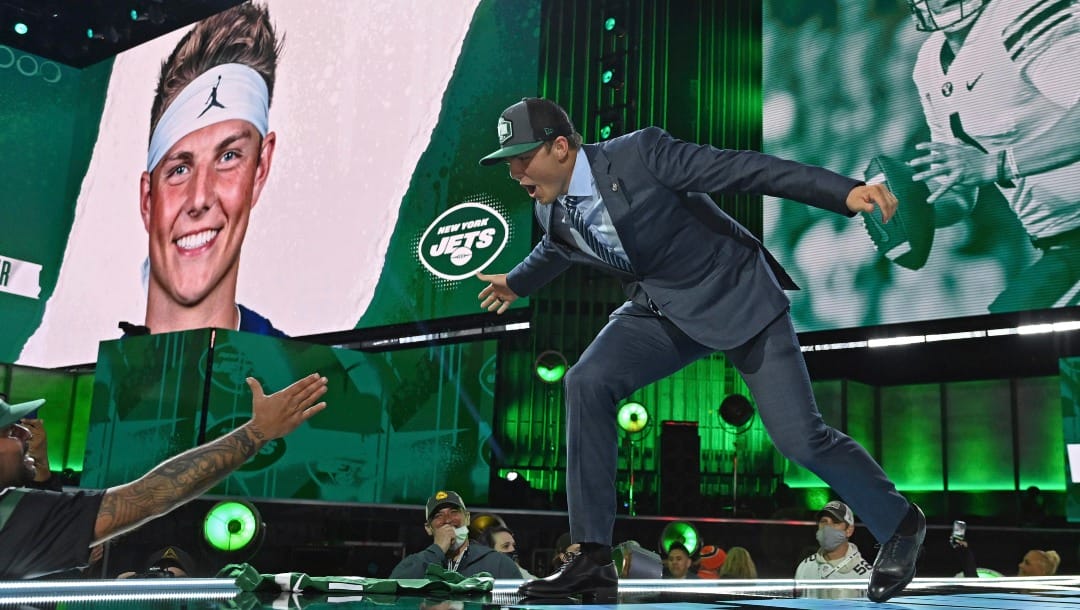 BYU quarterback Zach Wilson, right, greets fans after being selected by the New York Jets with the second pick in the NFL football draft Thursday, April 29, 2021, in Cleveland. (AP Photo/David Dermer)