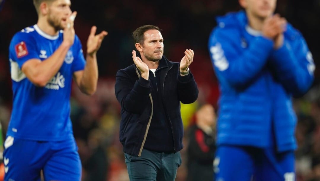 Everton's head coach Frank Lampard applauds after the English FA Cup soccer match between Manchester United and Everton at Old Trafford in Manchester, England, Friday, Jan. 6, 2023.
