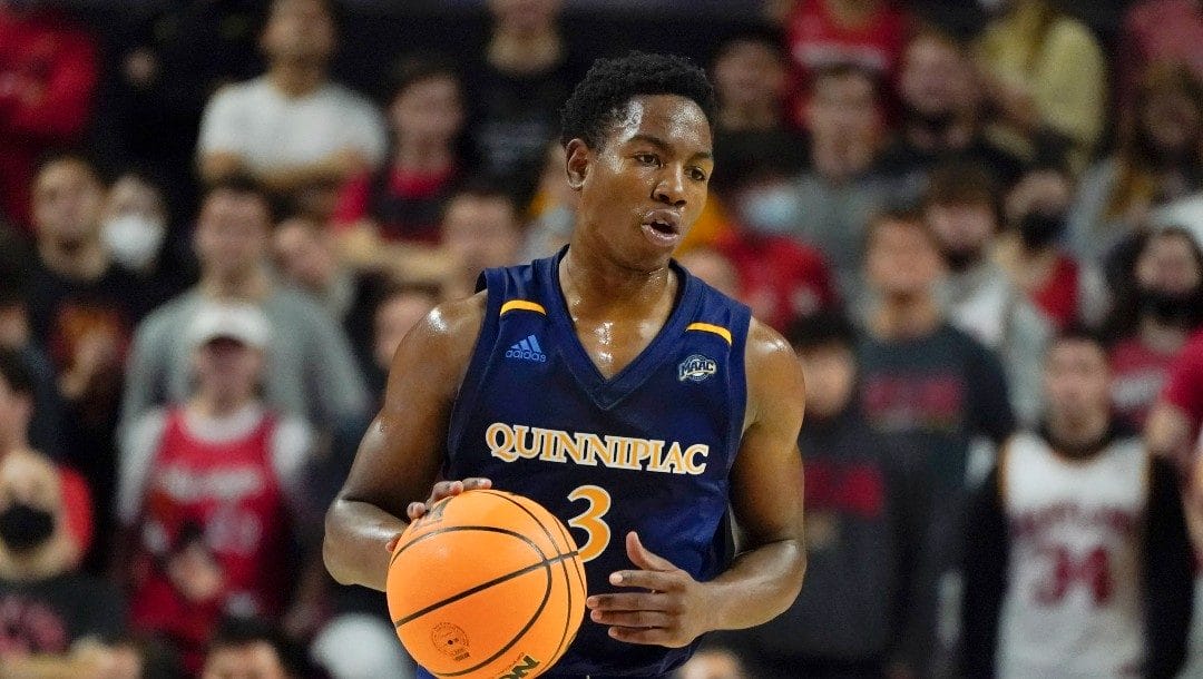 Quinnipiac's Savion Lewis dribbles up court against Maryland during the first half of an NCAA college basketball game, Tuesday, Nov. 9, 2021, in College Park, Md.