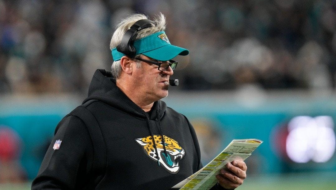 Jacksonville Jaguars head coach Doug Pederson looks onto the field to his players during the first half of an NFL wild-card football game against the Los Angeles Chargers, Saturday, Jan. 14, 2023, in Jacksonville, Fla.
