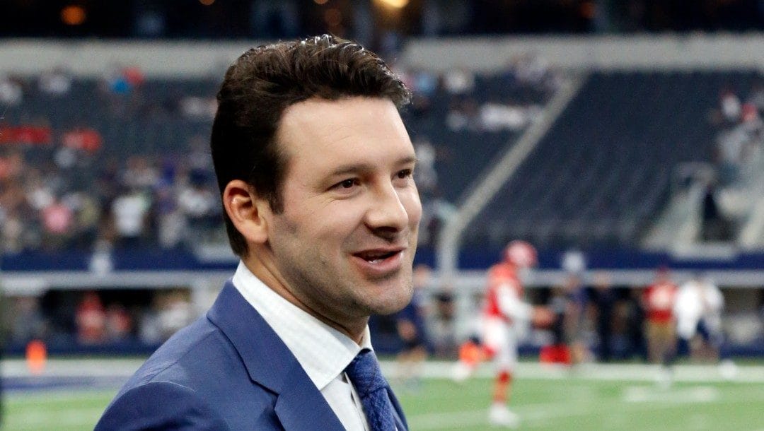 In this Nov. 5, 2017, file photo, CBS football analyst Tony Romo walks across the field during warm ups before an NFL football game between the Kansas City Chiefs and Dallas Cowboys, in Arlington, Texas.
