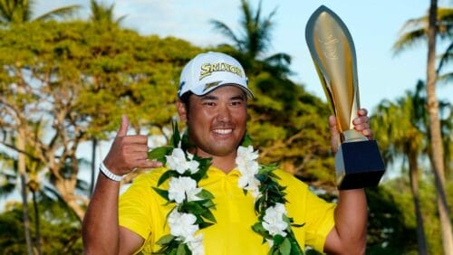 Hideki Matsuyama, of Japan, holds the champions trophy after the final round of the Sony Open golf tournament, Sunday, Jan. 16, 2022, at Waialae Country Club in Honolulu.