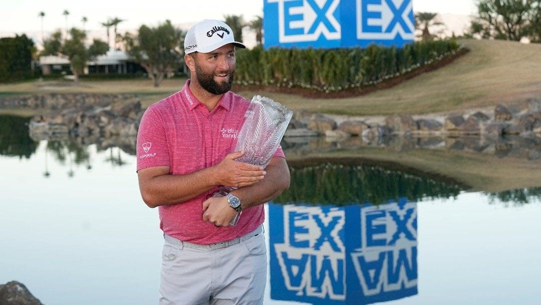 Jon Rahm hold the winner's trophy after the American Express golf tournament on the Pete Dye Stadium Course at PGA West Sunday, Jan. 22, 2023, in La Quinta, Calif.