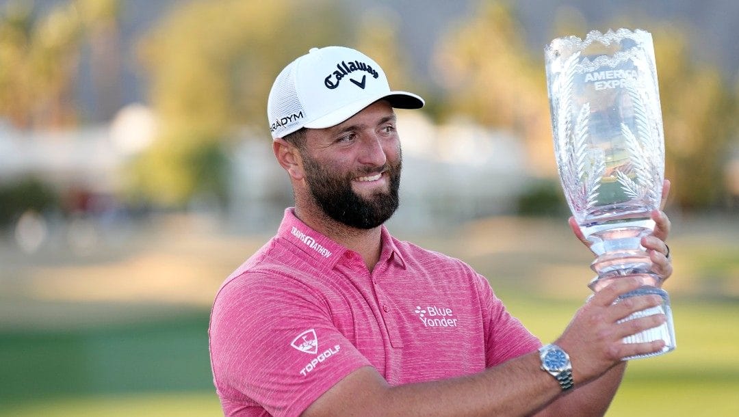Jon Rahm hold the winner's trophy after the American Express golf tournament on the Pete Dye Stadium Course at PGA West Sunday, Jan. 22, 2023, in La Quinta, Calif.