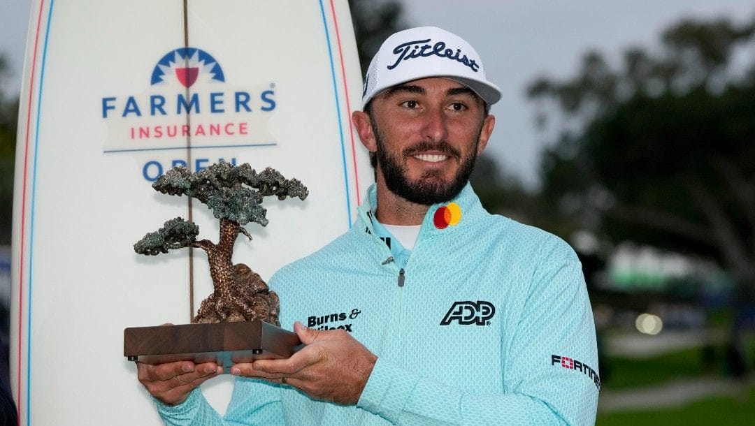Max Homa holds the trophy after winning the Farmers Insurance Open golf tournament, Saturday, Jan. 28, 2023, in San Diego.