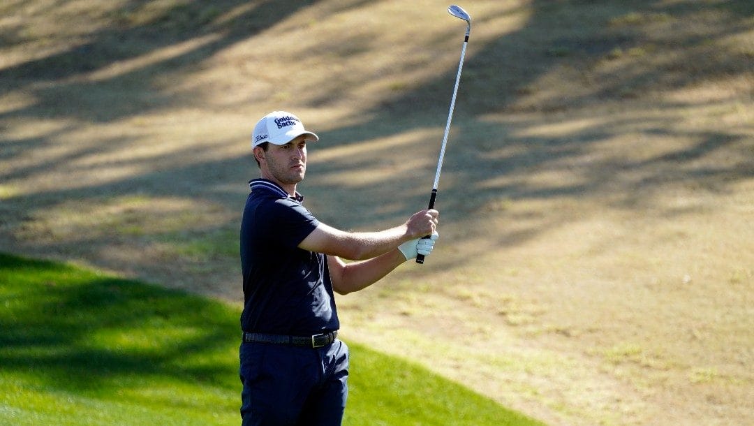 Patrick Cantlay watches his hit from the third fairway during the final round of the American Express golf tournament on the Pete Dye Stadium Course at PGA West Sunday, Jan. 23, 2022, in La Quinta, Calif.