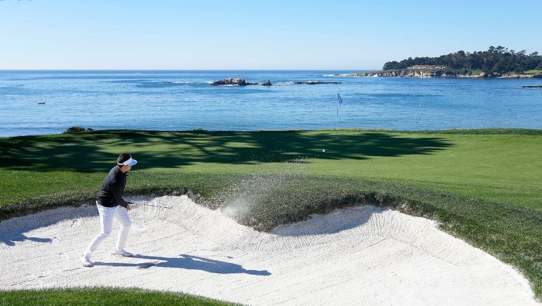 Beau Hossler hits out of a bunker onto the fourth green of the Pebble Beach Golf Links during the final round of the AT&T Pebble Beach National Pro-Am golf tournament in Pebble Beach, Calif., Sunday, Feb. 6, 2022.