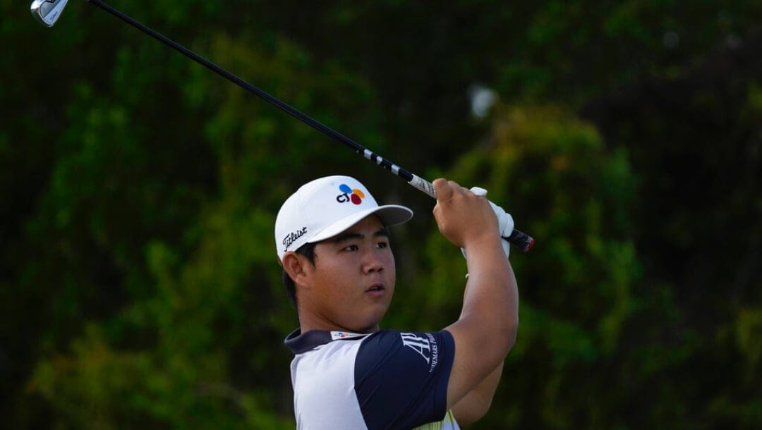 Tom Kim, of South Korea, watches his shot on the 7th tee during the second round of the Hero World Challenge PGA Tour at the Albany Golf Club in New Providence, Bahamas, Friday, Dec. 2, 2022.
