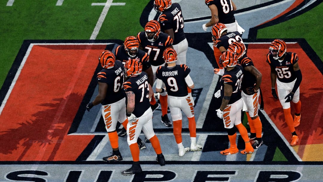 Cincinnati Bengals quarterback Joe Burrow (9) huddles with teammates against the Los Angeles Rams during the NFL Super Bowl 56 football game Sunday, Feb. 13, 2022, in Inglewood, Calif. (AP Photo/Adam Hunger)