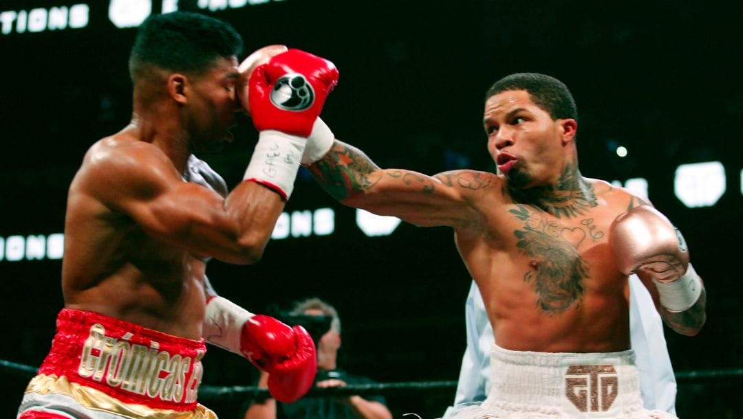 FILE - In this Dec. 29, 2019 file photo, Gervonta Davis punches Cuban Yuriorkis Gamboa during the WBA lightweight title bout.