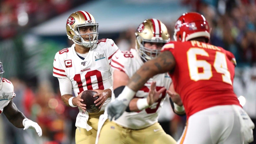 San Francisco 49ers quarterback Jimmy Garoppolo (10) drops back to pass against the Kansas City Chiefs in Super Bowl 54, Sunday, Feb. 2, 2020 in Miami Gardens, Fla. The Chiefs defeated the 49ers 31-20. (AP Photo/Doug Benc)