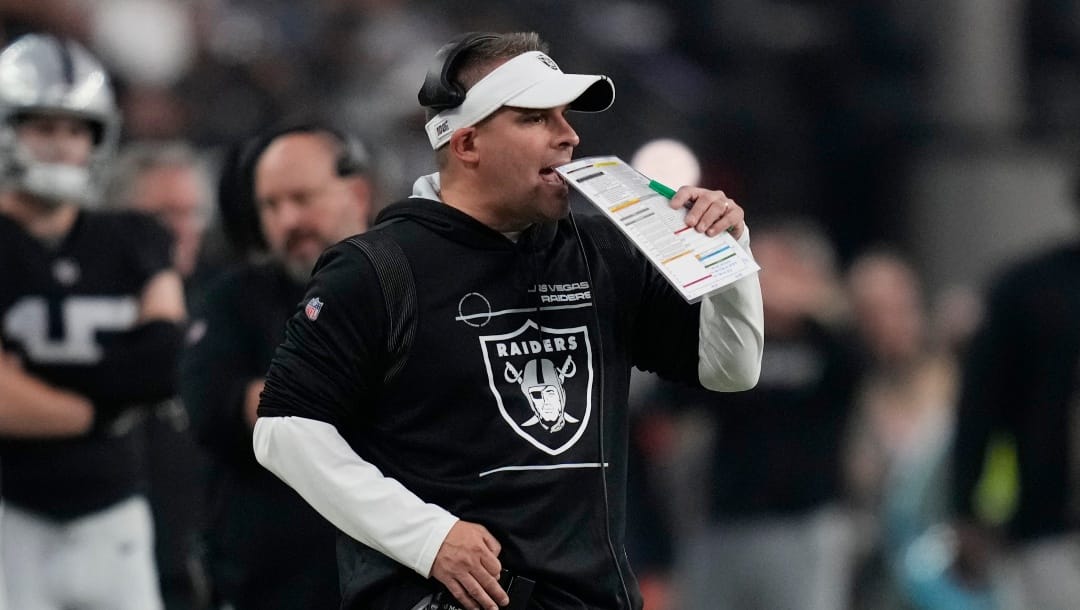 Las Vegas Raiders head coach Josh McDaniels stands on the sidelines during the second half of an NFL football game against the Kansas City Chiefs, Wednesday, Jan. 11, 2023, in Las Vegas. (AP Photo/John Locher)