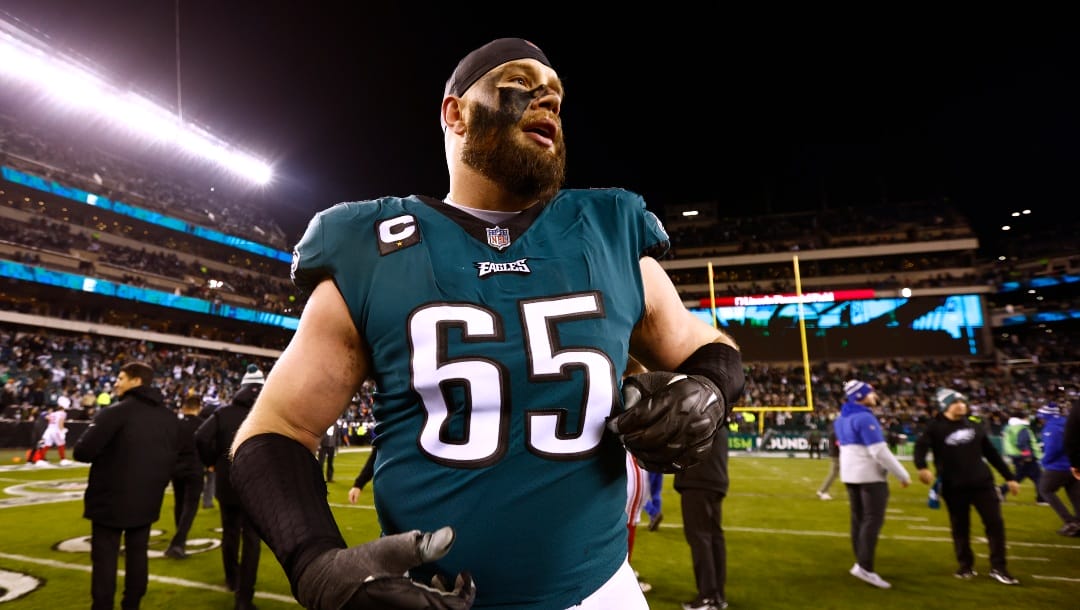 Philadelphia Eagles offensive tackle Lane Johnson (65) celebrates as he runs off the field after defeating the New York Giants 38-7 in an NFL divisional round playoff football game, Saturday, Jan. 21, 2023, in Philadelphia. (AP Photo/Rich Schultz)