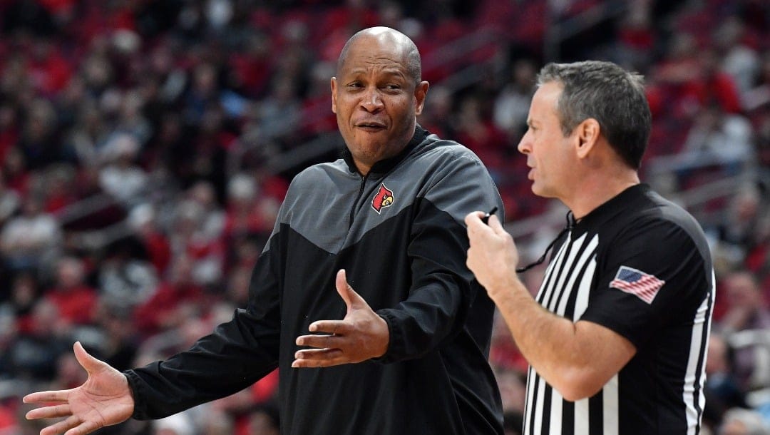 Louisville head coach Kenny Payne argues with a game official during the first half of an NCAA college basketball game against Wake Forest in Louisville, Ky., Saturday, Jan. 7, 2023.