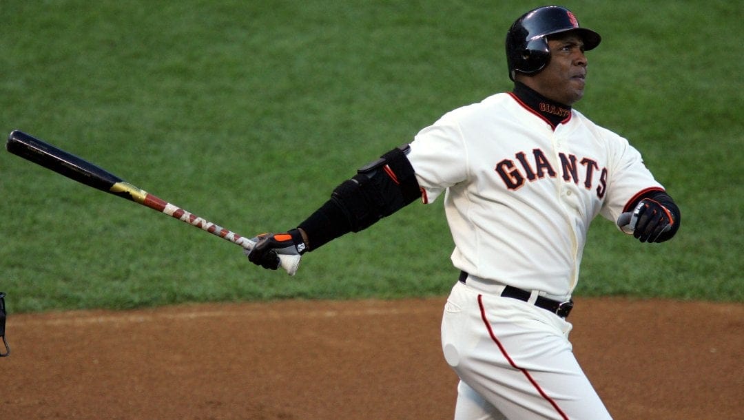 San Francisco Giants' Barry Bonds watches the flight of a foul ball against the Colorado Rockies in the first inning of a baseball game on Saturday, Aug. 5, 2006, in San Francisco.