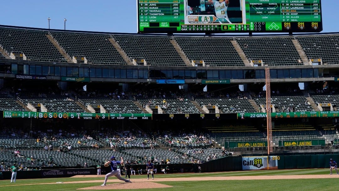 Texas Rangers pitcher Jon Gray (22) throws to an Oakland Athletics batter during the eighth inning of a baseball game in Oakland, Calif., Saturday, May 13, 2023. (AP Photo/Jeff Chiu)