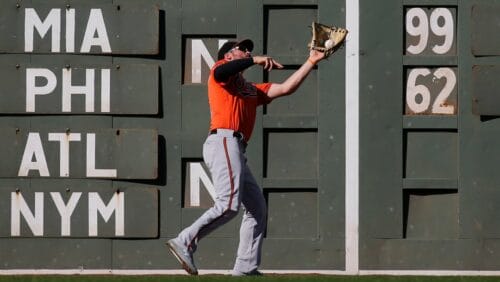 Baltimore Orioles outfielder Trey Mancini (16) makes a catch at the wall on a fly ball by Boston Red Sox Brock Holt during the sixth inning of a baseball game, Saturday, Sept. 28, 2019, in Boston.