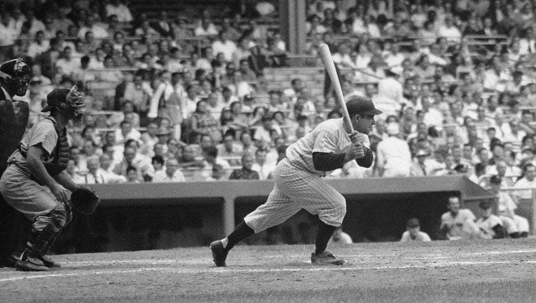 Yogi Berra, star catcher for the New York Yankees, shows the wrist action which helps provide the power that makes him one of the teams long ball threats, Sept. 6, 1955. Berra, hitting .273, has pounded out 23 homes and has driven in 94 runs. He has hit 18 doubles and two triples.