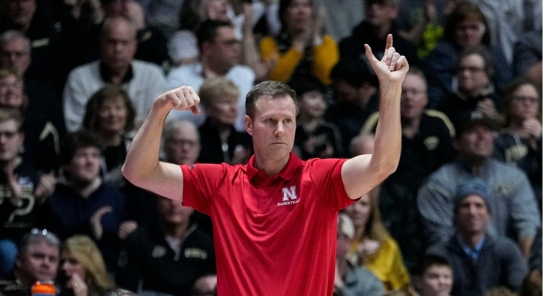 The Nebraska Cornhuskers coach signaling with his hands