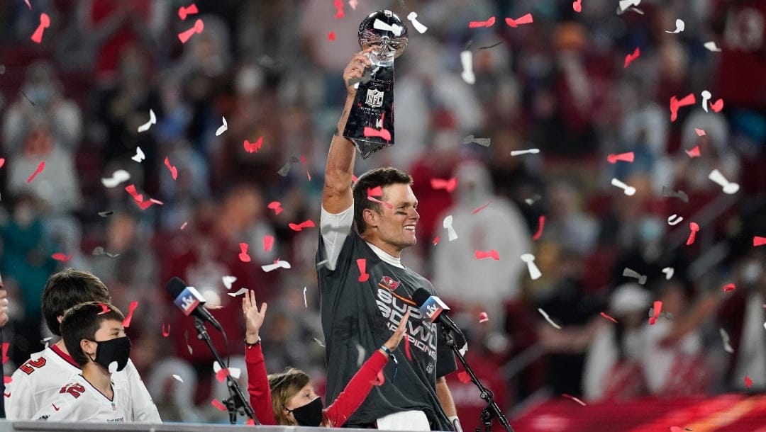 Tampa Bay Buccaneers quarterback Tom Brady holds up the Vince Lombardi trophy