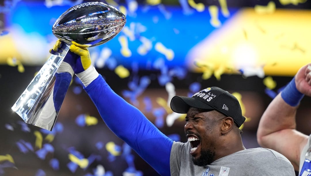 Then-Los Angeles Rams outside linebacker Von Miller holds up the Lombardi Trophy