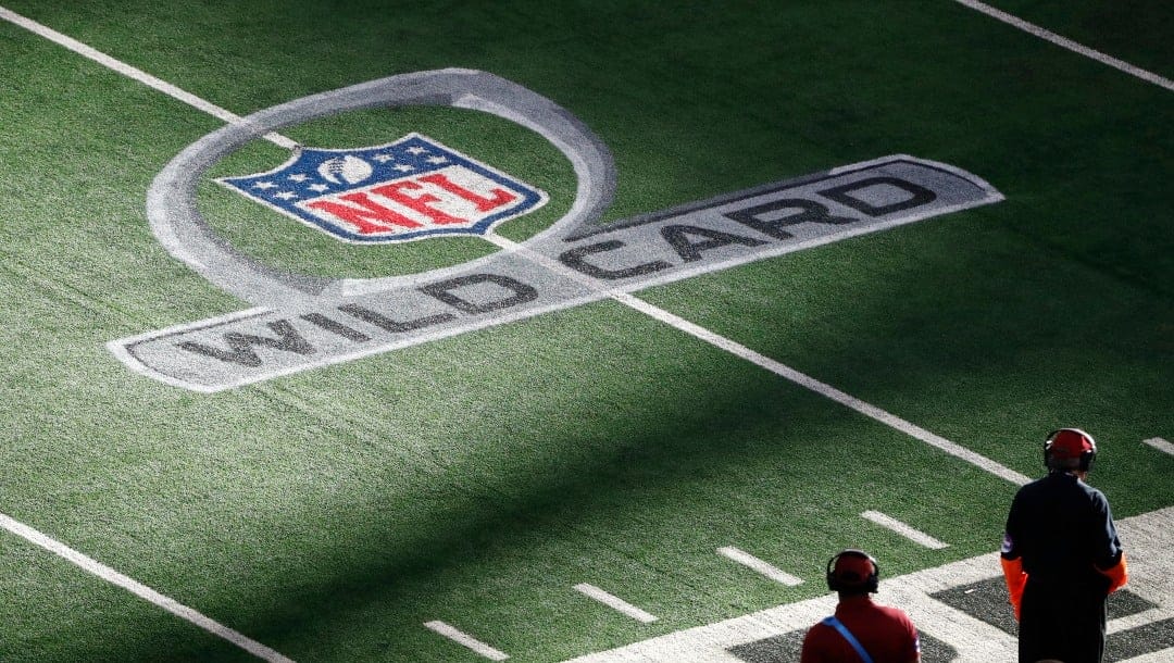 A Wild Card logo is shown on the field at AT&T Stadium is shown during the first half of an NFL wild-card playoff football game between the Dallas Cowboys and the San Francisco 49ers in Arlington, Texas, Sunday, Jan. 16, 2022. (AP Photo/Roger Steinman)