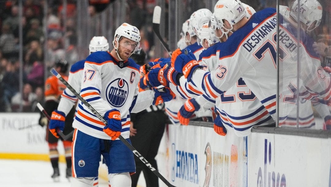 Edmonton Oilers' Connor McDavid (97) is congratulated for his goal during the first period of the team's NHL hockey game against the Anaheim Ducks on Wednesday, Jan. 11, 2023, in Anaheim, Calif.