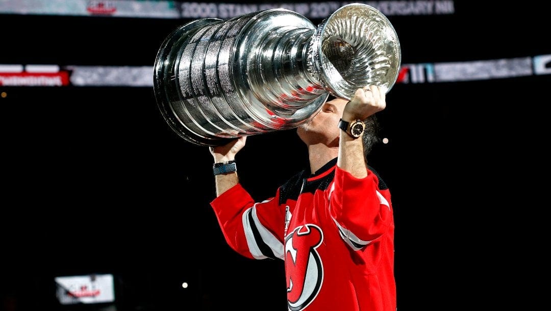 Former New Jersey Devils player Petr Sykora kisses the Stanley Cup during ceremony to honor the 2000 Stanley Cup team Saturday, Feb. 1, 2020, in Newark, N.J.