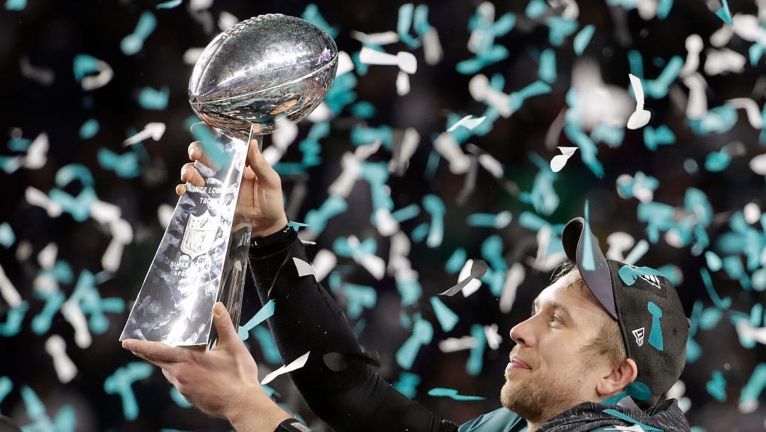 FILE - In this Feb. 4, 2018, file photo, Philadelphia Eagles' Nick Foles holds up the Vince Lombardi Trophy after the NFL Super Bowl 52 football game against the New England Patriots, in Minneapolis. The NFL is launching a "Lombardi in Your Hometown" contest, which will send the NFL's championship trophy to one winner's hometown during wild-card weekend in January. The trophy will appear at a watch party for the winner and friends and family before heading to Miami for the Super Bowl in February. (AP Photo/Chris O'Meara, File)