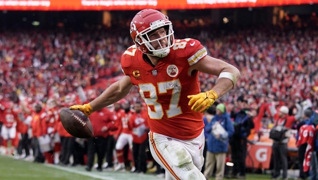 Kansas City Chiefs tight end Travis Kelce scores a touchdown against the Jacksonville Jaguars during an NFL Divisional Playoff football game Saturday, Jan. 21, 2023, in Kansas City, Mo. (AP Photo/Ed Zurga)