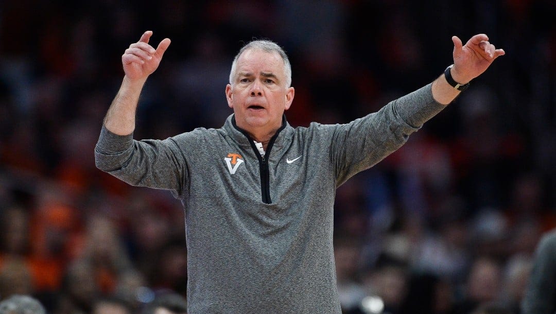 Virginia Tech coach Mike Young directs players during the second half of an NCAA college basketball game against Syracuse in Syracuse, N.Y., Wednesday, Jan. 11, 2023.